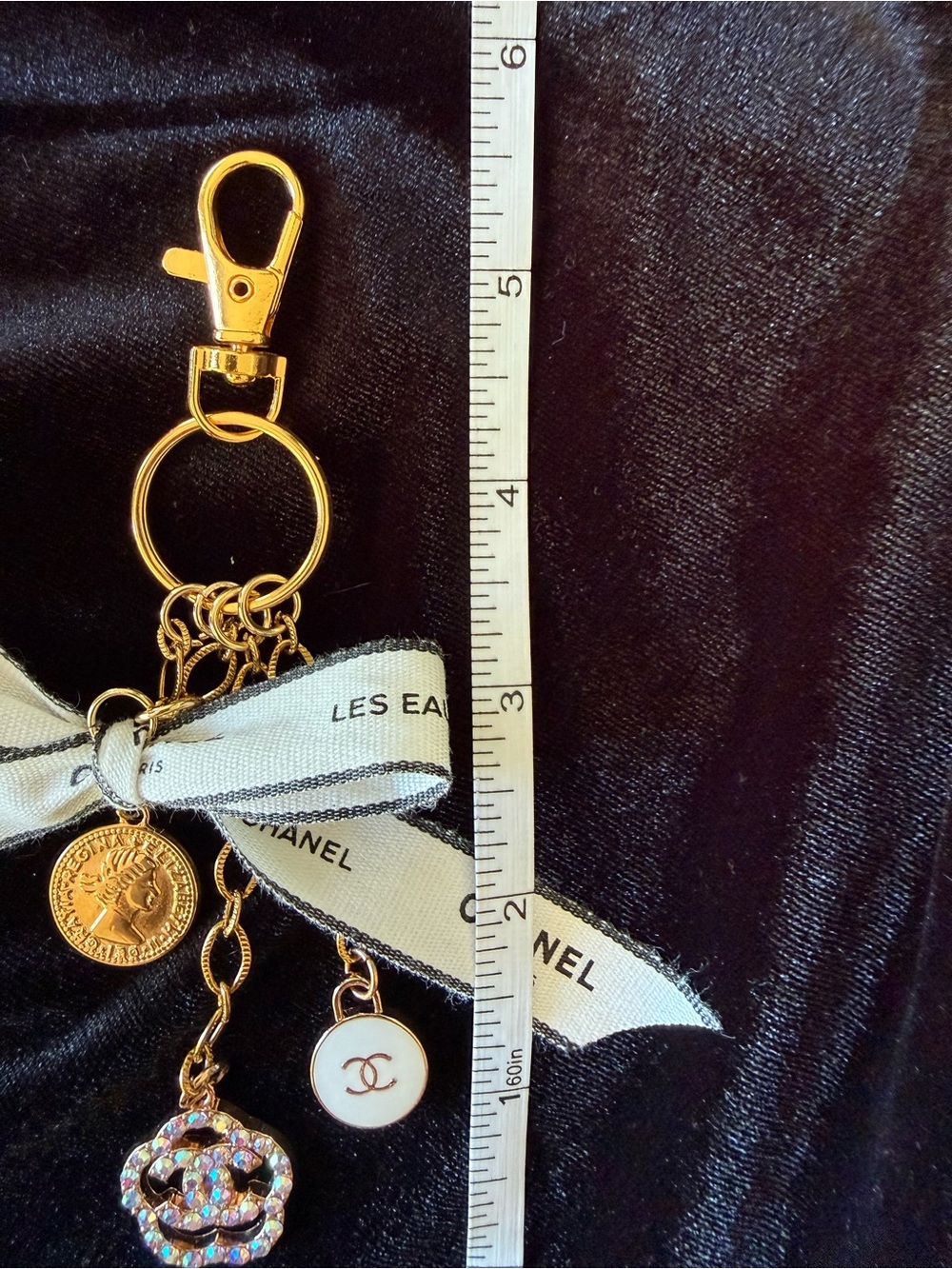 ChaneI Gold-Tone Keyring with White Ribbon and Black Logo and Gold Charms - Picture 4 of 10